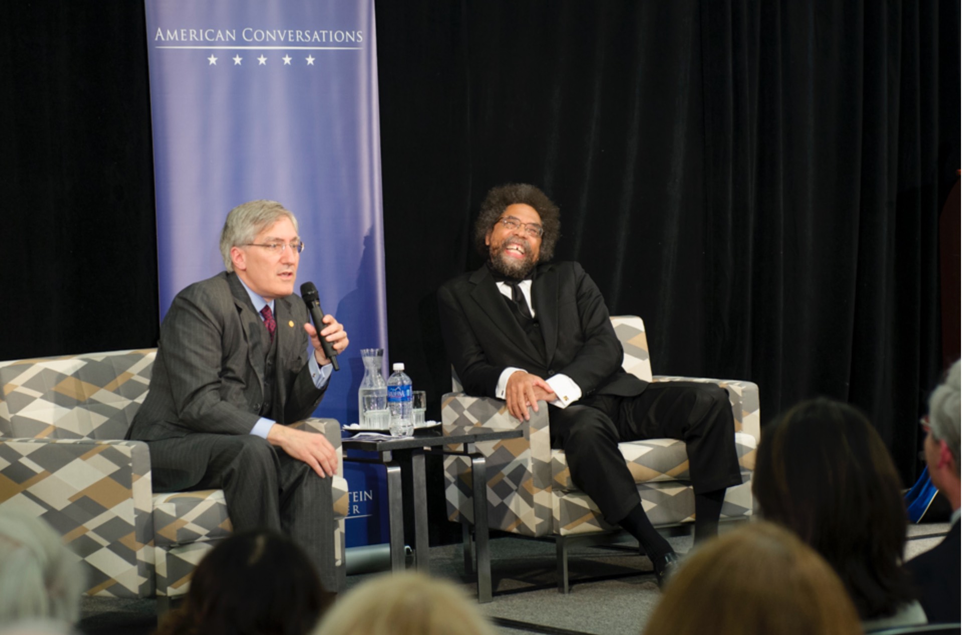 Cornel West and Robert George on stage
